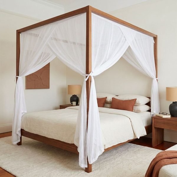 Canopy bed curtains pinned taut to the top rails of a four poster bed for a flat canopy top